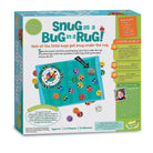 Board game packaging for 'Snug as a Bug in a Rug' with colorful design and text.