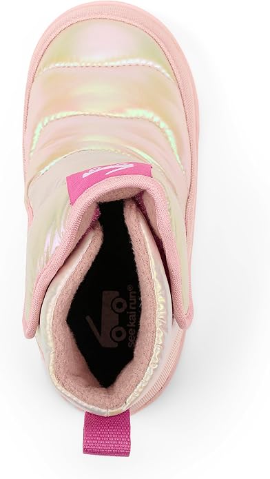 A pink ankle boot with an iridescent, holographic finish on the exterior and a plush pink interior, shown from a top-down angle on a white background.