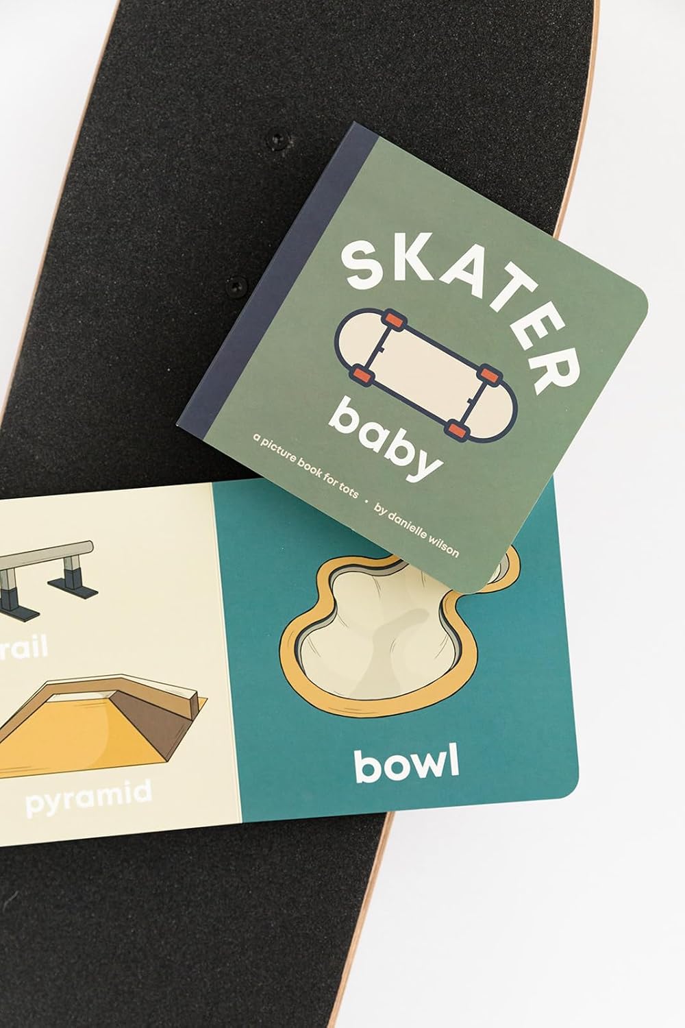 Skateboarding-themed children's book with illustrations of skateboarding elements on a skateboard.