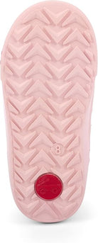 A close-up of a light pink shoe sole with a textured chevron tread pattern and a small red circular logo near the heel.