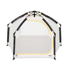 Portable playpen with mesh sides and black frame on a white background, featuring the brand 'veer'.