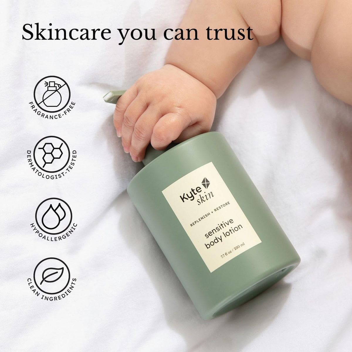 Green bottle of Kyle Skin sensitive body lotion held by a child's hand on a white background with brand icons and text.