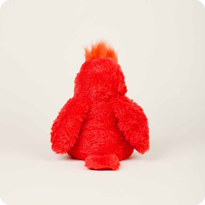 A rear-view profile of the Red Cardinal by Warmies plush toy, showcasing its bright red fuzzy fur, textured crest on top of its head, and soft rounded back against a neutral background.