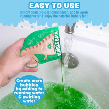 Hand pouring a green bubble bath packet into a bathtub with bubbles and text on a blue background.