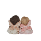 Two dolls with butterfly wings on a white background