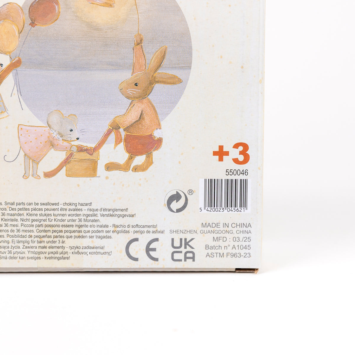 Product packaging with cartoon characters and safety information on a white background