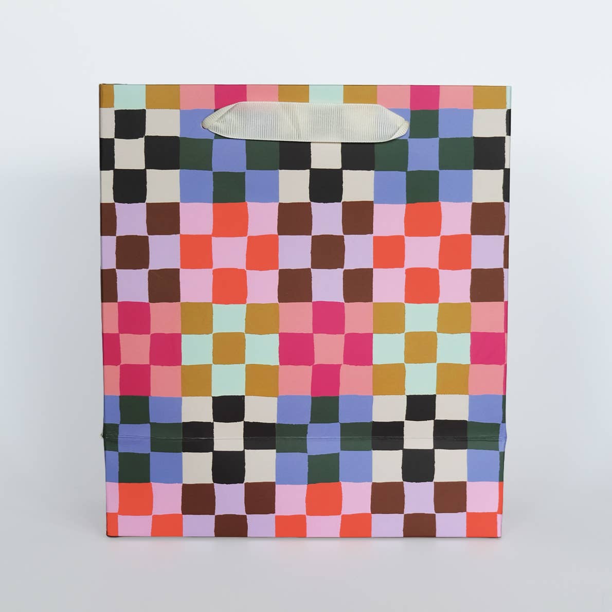 Colorful checkered paper bag on a white background