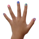 Hand with colorful nail art on a white background