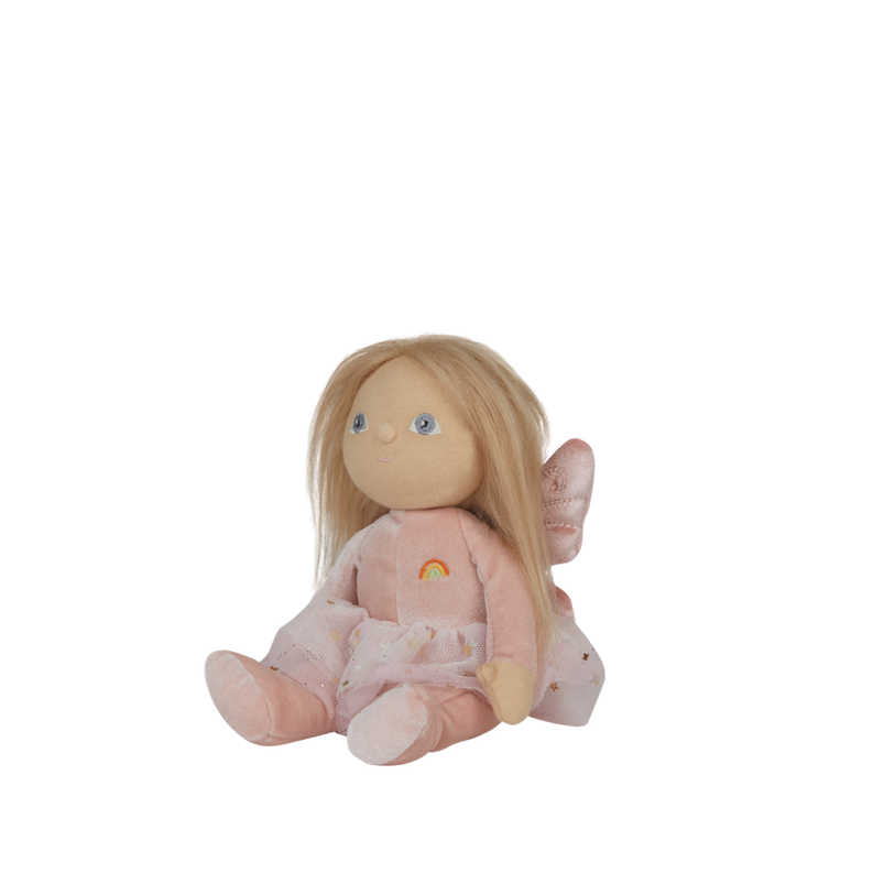 Plush toy fairy with pink outfit and rainbow on a white background