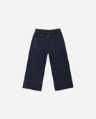 Dark navy blue denim cropped pants with an elastic waistband and back pocket details, shown from the back on a light gray background.