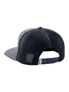 A navy blue trucker cap with a black mesh back and a navy and white striped brim, shown from a rear three-quarter angle on a white background.