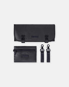 Black travel accessory set with a pouch, wallet, and key holder on a white background