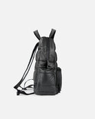 Black backpack on a light gray background