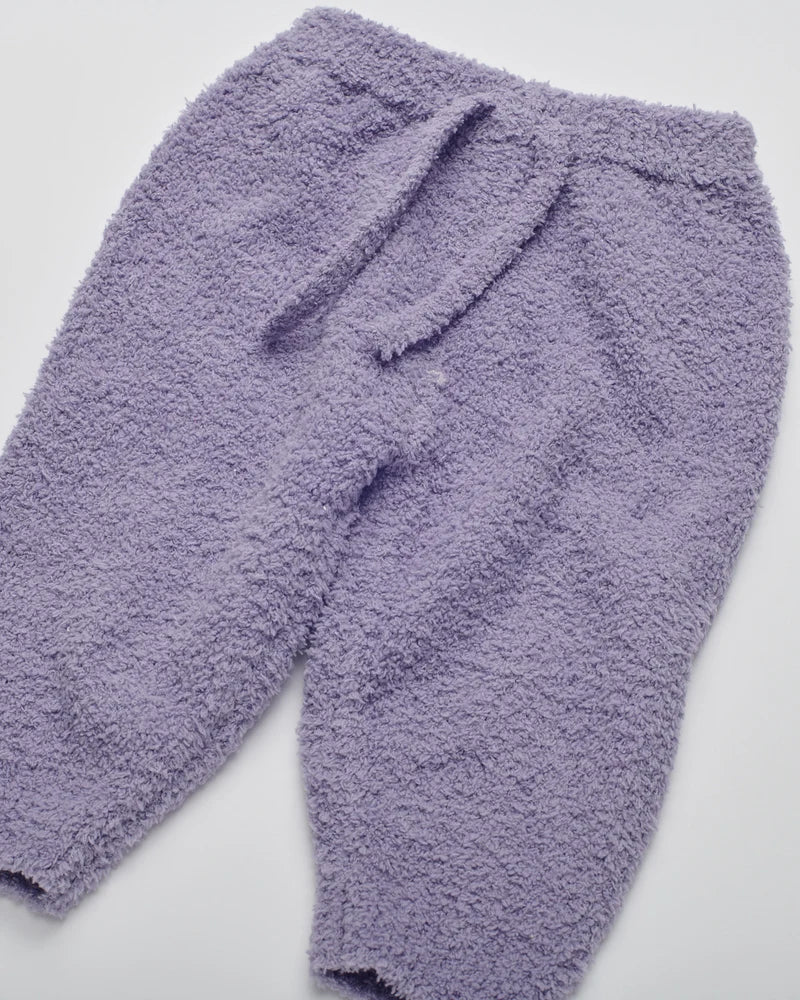 Soft, fuzzy knit lounge pants in a solid taro purple shade with an elastic waistband and matching drawstring.