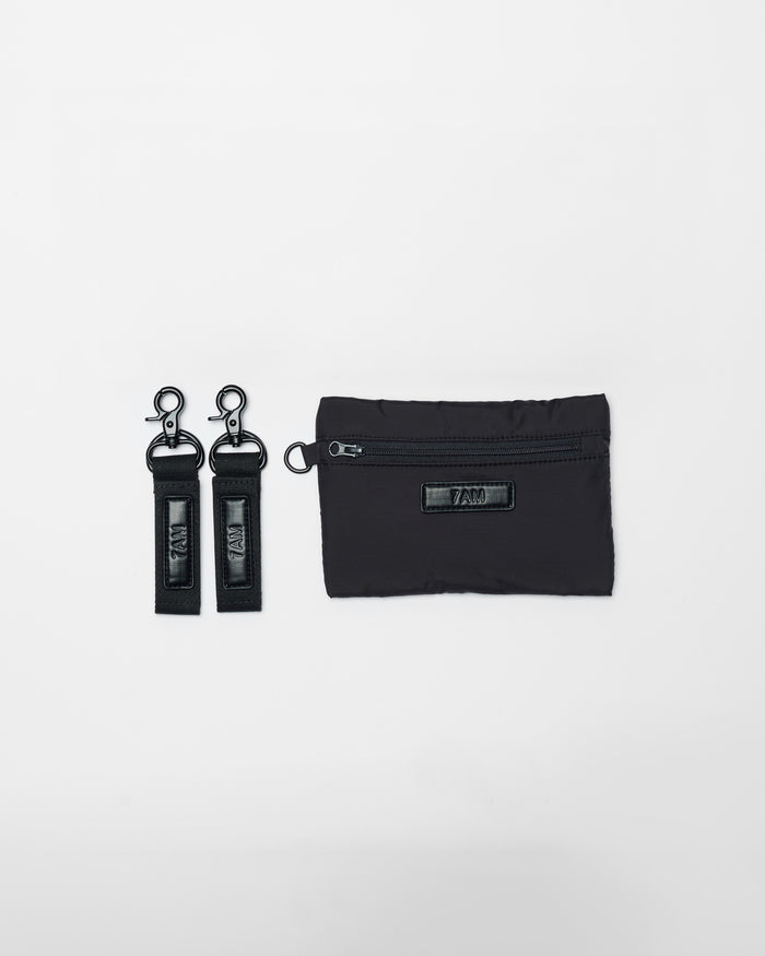 Black keychain and pouch set on a white background