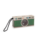 Vintage-style toy camera with a strap on a white background