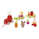 Set of colorful wooden toys including a rabbit, vegetables, and a chicken on a white background