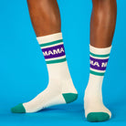 White socks with purple and green stripes labeled 'MAMA' on a blue background