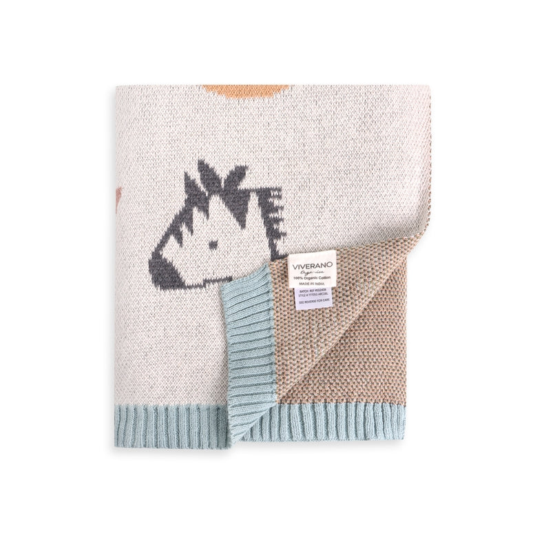 Knitted blanket with zebra design and Vivarano label on a white background