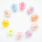 Colorful flower-shaped candies on a white background