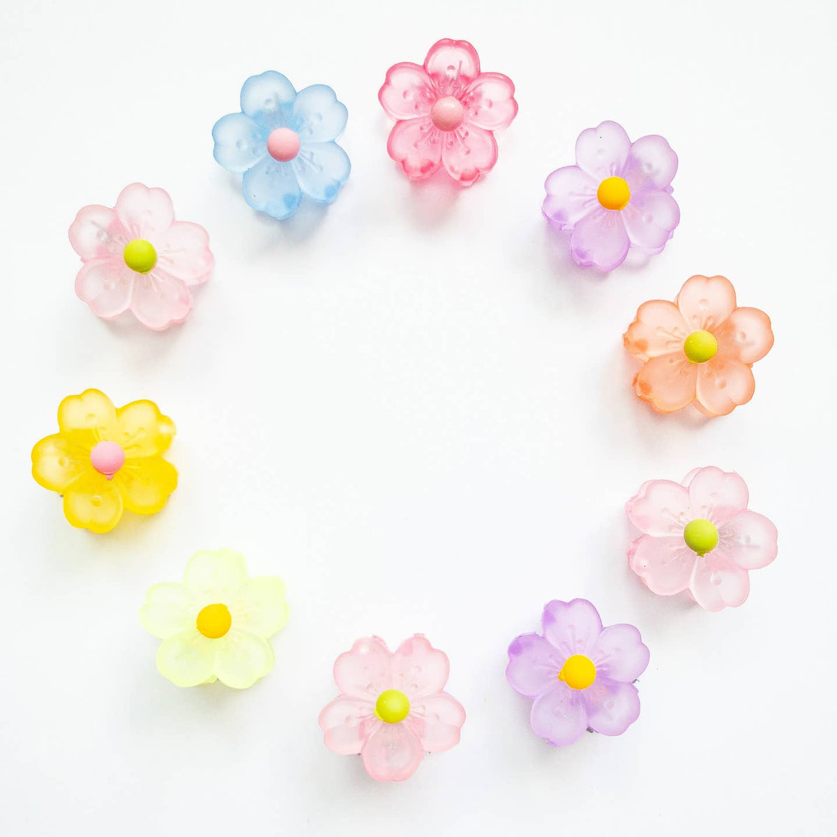 Colorful flower-shaped candies on a white background