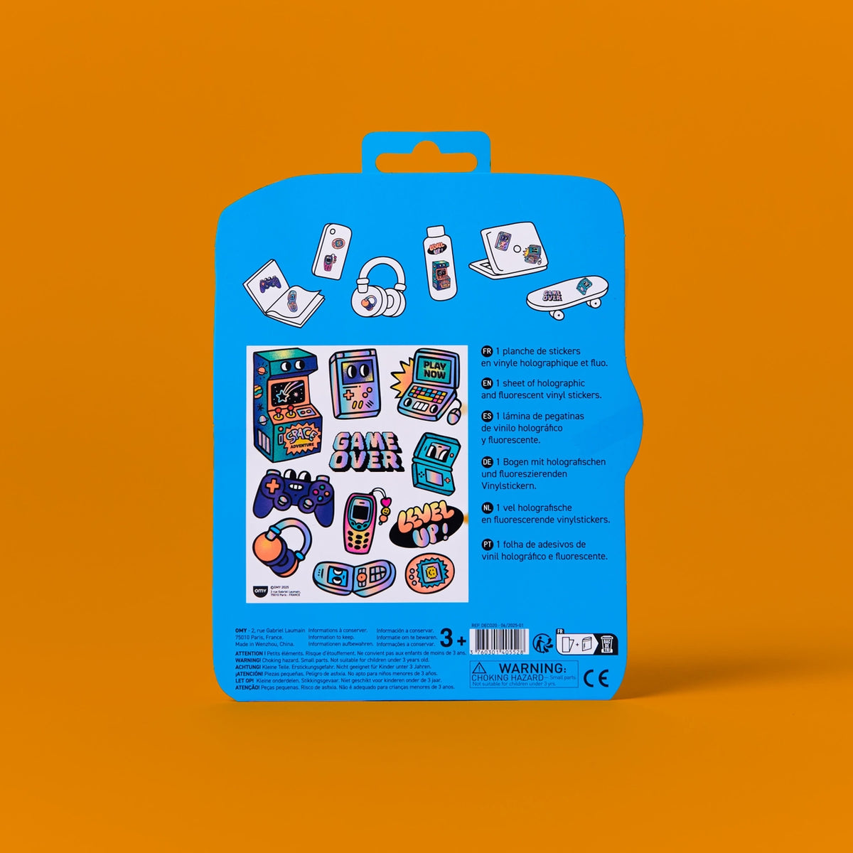 Blue packaging with gaming-themed stickers on an orange background