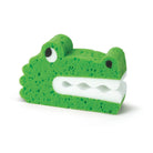 Green alligator-shaped sponge on a white background