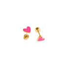 Pair of gold heart-shaped earrings with pink hearts on a white background