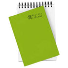 Green notebook with 'Melissa LeBlanc' branding on a white background