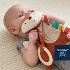 Baby holding a soft toy with text 'Snuggly Soft Lovey' on a neutral background