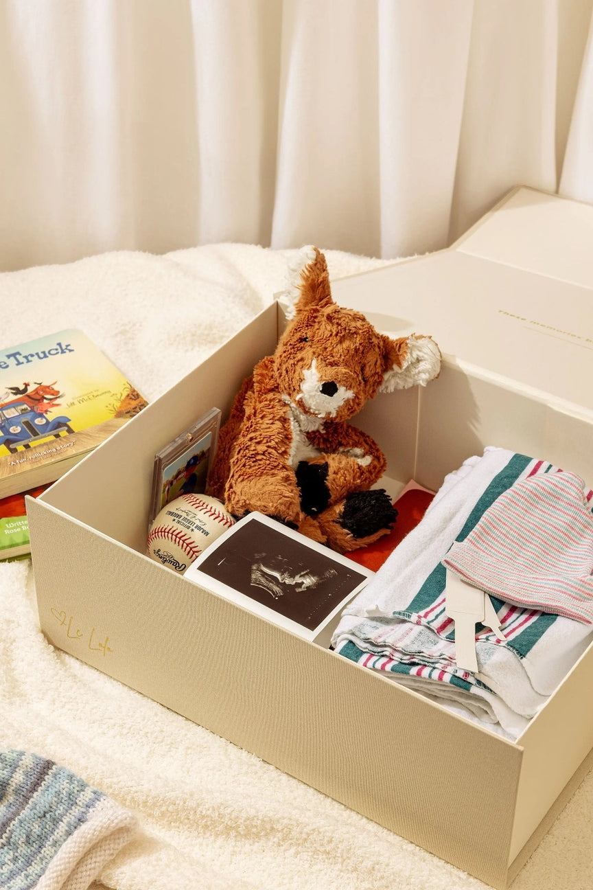 Storage box with toys and clothes on a bed