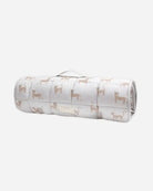 A baby travel pillow and blanket set displayed on a white stand against a solid white background.