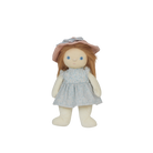 Stuffed doll with a pink hat and blue dress on a white background