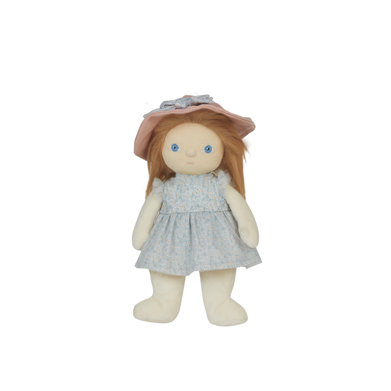Stuffed doll with a pink hat and blue dress on a white background