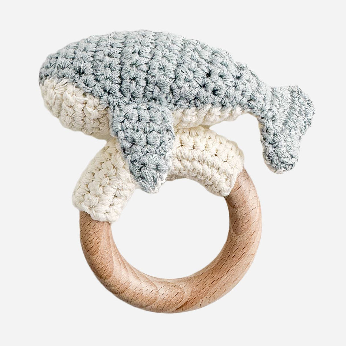 Crocheted ring with a wooden center on a white background