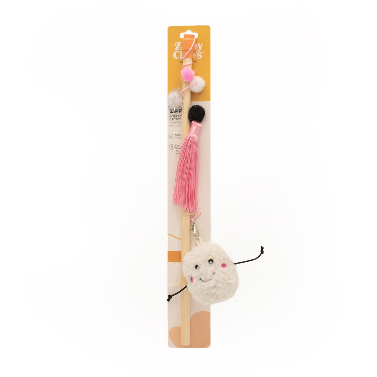 A wooden cat toy stick with a pink tassel, a fluffy cream-colored pom-pom character charm with a smiling face, and a black tail, shown on its original cardboard packaging against a white background.