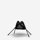 Black portable chair with legs on a white background