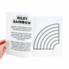Book open to a page with a rainbow illustration and text.