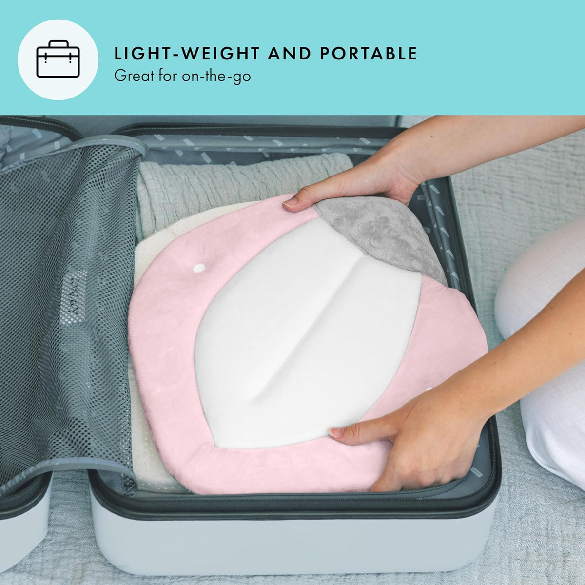 Person placing a pink and white cushion into a suitcase with text 'Lightweight and Portable' on a teal background.