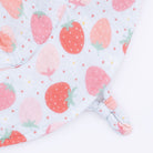 Close-up sun hat with strawberry pattern on a white background