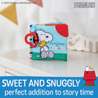 Children's book with cartoon characters on a white surface, featuring Snoopy and Woodstock.
