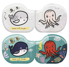 Two small containers with whale and octopus illustrations on a white background