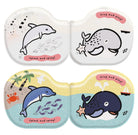 Set of four children's toys with dolphin and whale designs on a white background