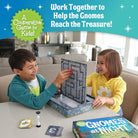 Two children playing with a board game titled 'Gnomes at Night' in a living room setting.