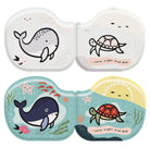 Two contact lens cases with whale and turtle designs on a white background