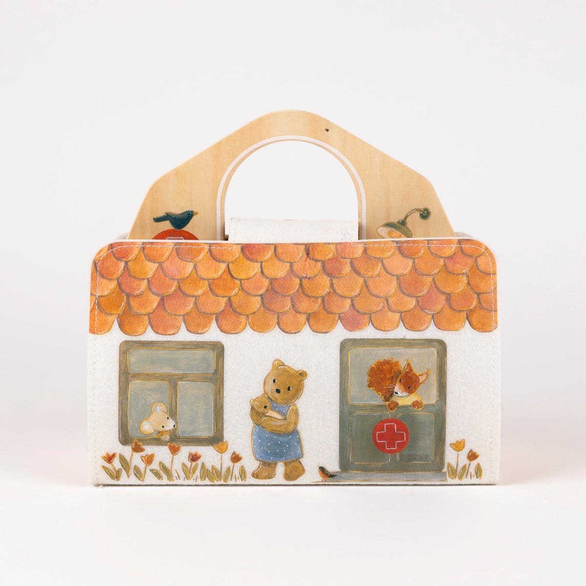 Decorative box with cartoon characters and a tiled roof on a white background