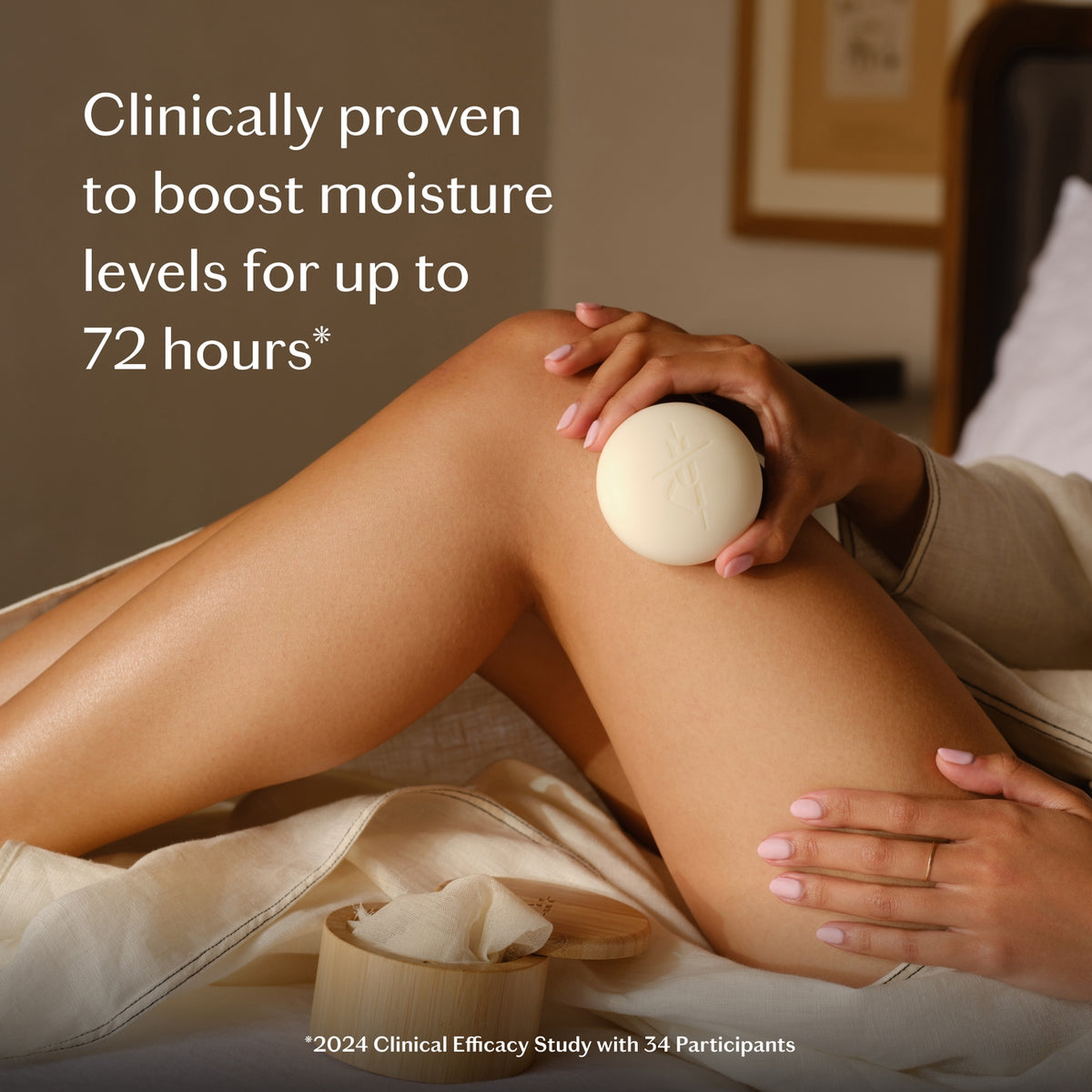 Person applying a skincare product to their leg with text about moisture levels.
