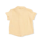 Yellow sleeveless shirt on a white background