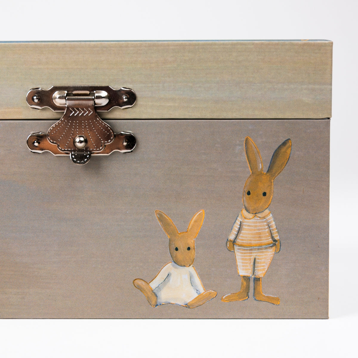 A rectangular wooden storage box with a light natural wood top and a painted gray-brown front featuring two bunny illustrations in cream, tan, and orange. The front has a decorative metal latch on the left side.
