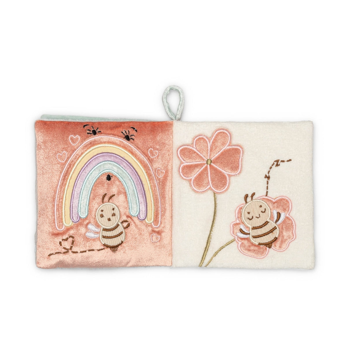 A square soft fabric book or pouch with a hanging loop, featuring embroidered bee and flower designs on a split pink and cream background.